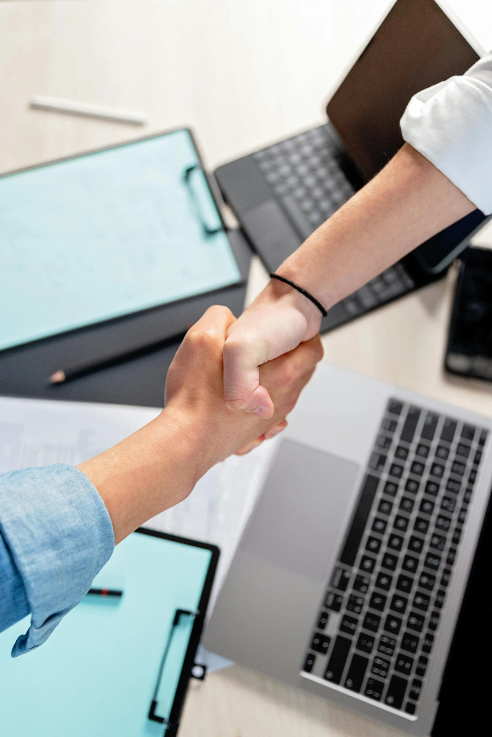 Two people shaking hands as a symbol of trust and partnership